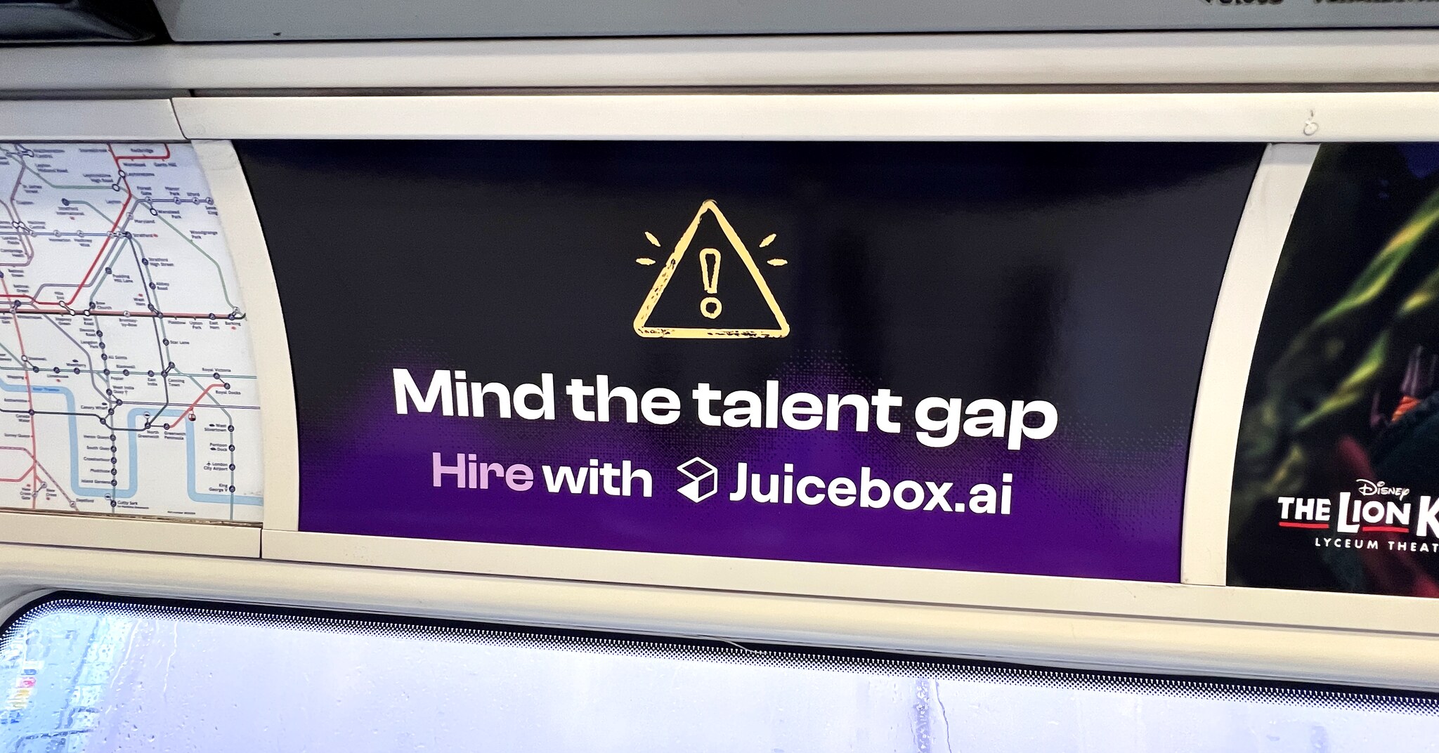 Photograph of an advert on the London Underground: Juicebox